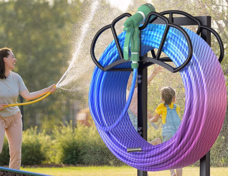 Person spraying water with colorful hose reel.