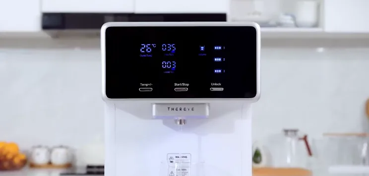 Modern water dispenser with digital display in kitchen.