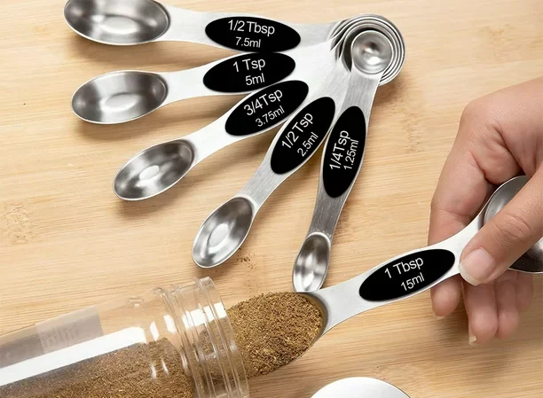 magnetic measuring spoons set on cuttingboard