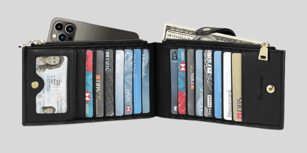 Open black wallet with cards and cash
