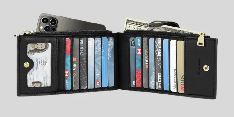 Open black wallet with cards and cash