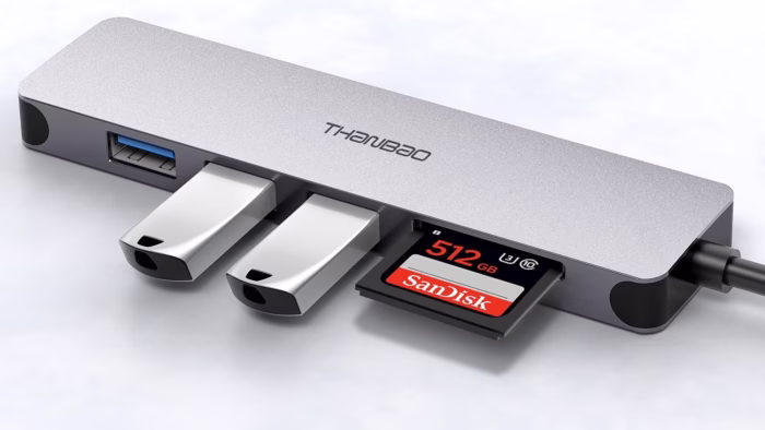 USB hub with drives and memory card inserted.