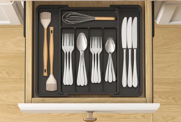 Drawer with organized silverware and kitchen utensils