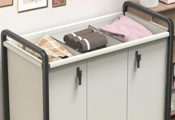 Towel storage cabinet with folded linens and towels.