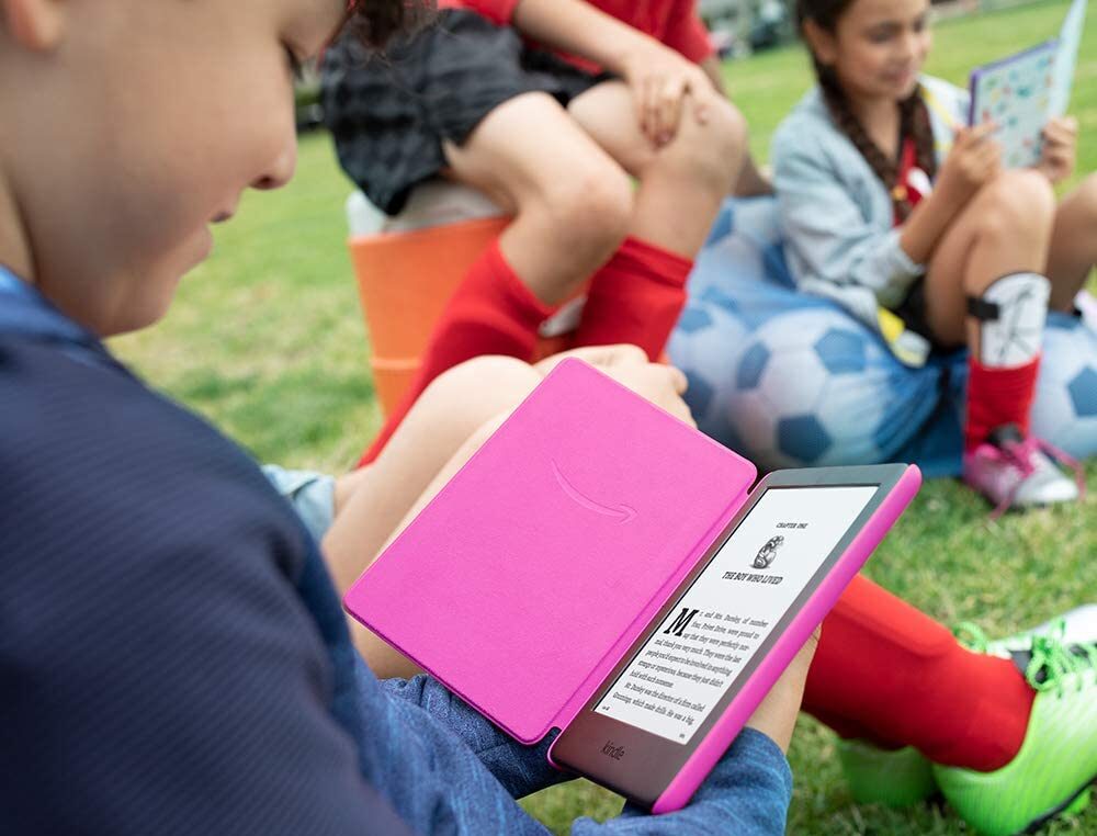 kids kindle kid reading in park