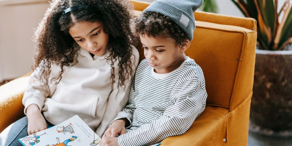 kids reading in a chair