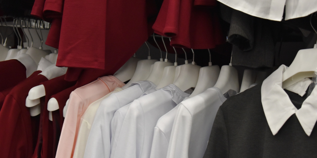 school uniforms on hangers