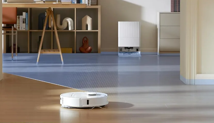 Robot vacuum cleaning living room floor.