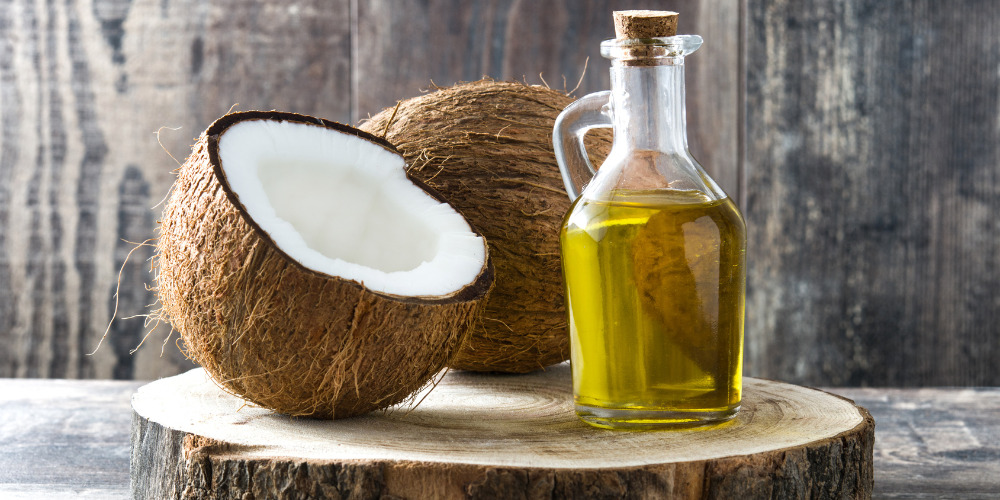 coconut oil in bottle with coconut