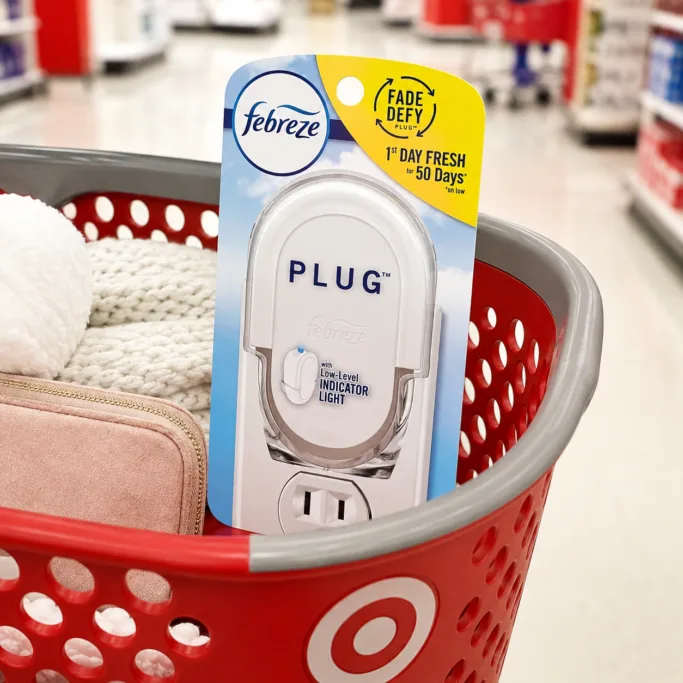 febreze plug in in a red shopping basket