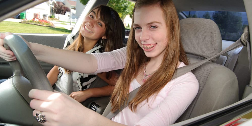 teens driving a car