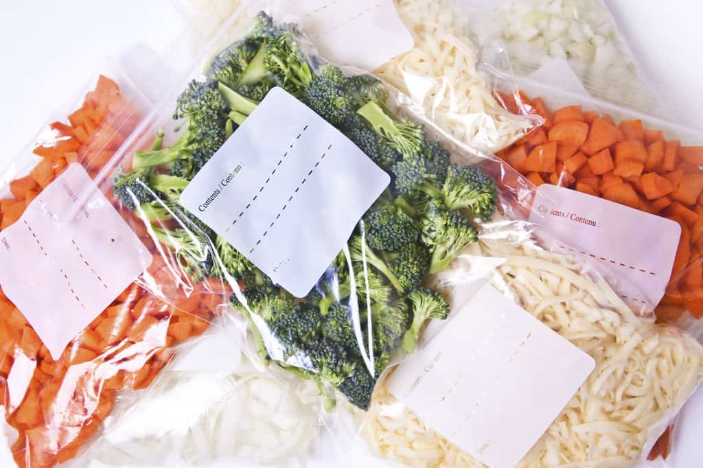 chopped vegetables and cheese in freezer bags