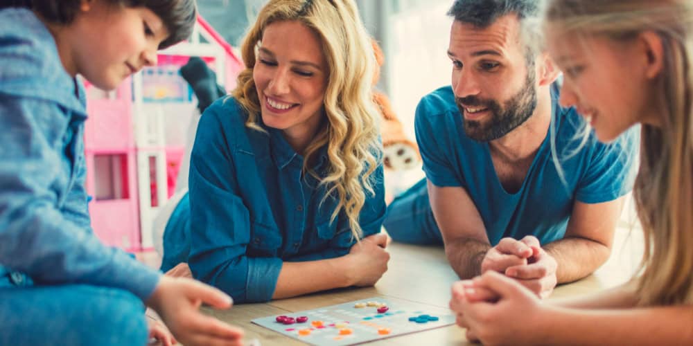 family playing board game