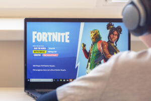 vilnius, lithuania july 2, 2019: boy playing fortnite game. fortnite is online video game developed by epic games