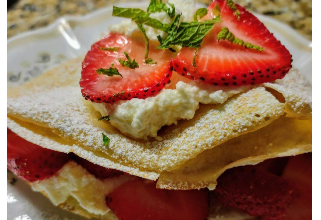 strawberry crepes with almond whipped cream