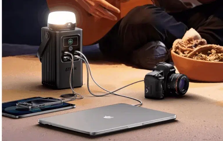 Portable power station charging camera and laptop