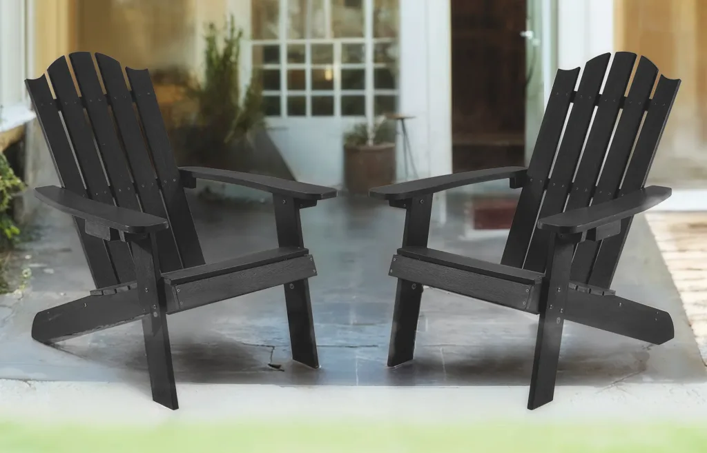 Two black Adirondack chairs on patio