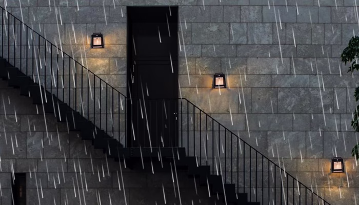 Staircase with rain and glowing wall lights