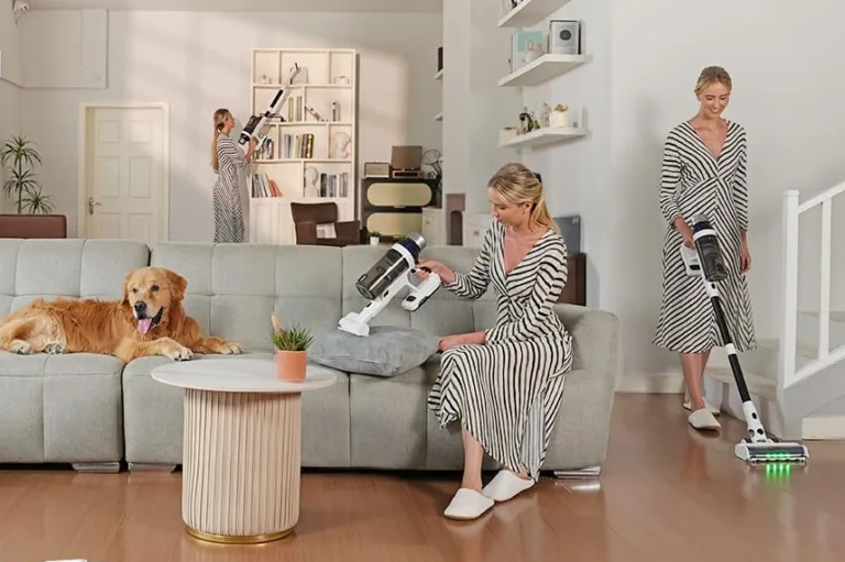 Woman using vacuum on sofa and floor