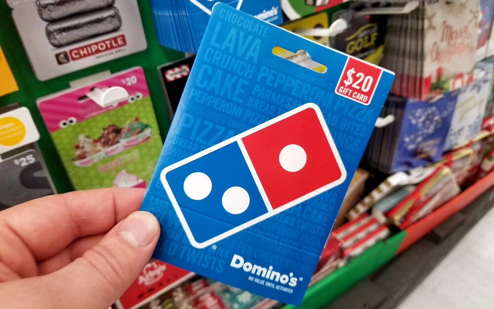 dominos pizza gift card in a hand