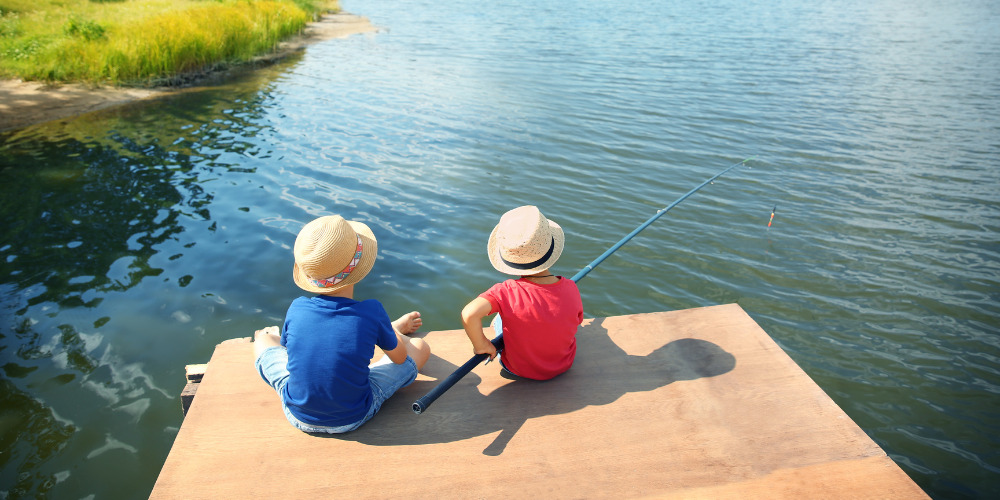 kids fishing on a dock