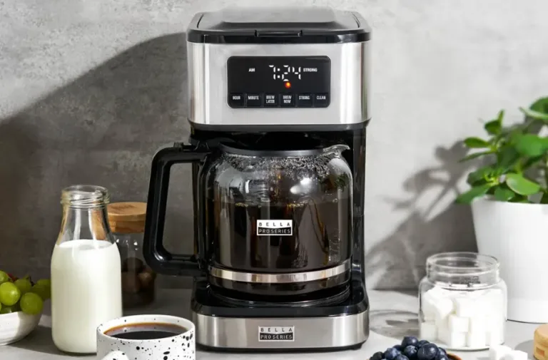 Stainless steel coffee maker on kitchen counter.