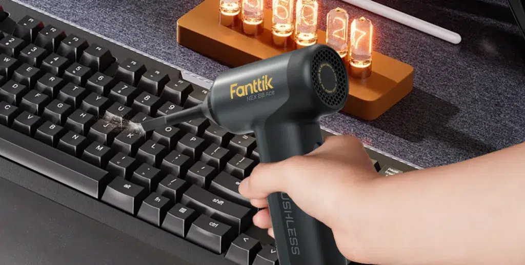 Keyboard cleaned with handheld air blower