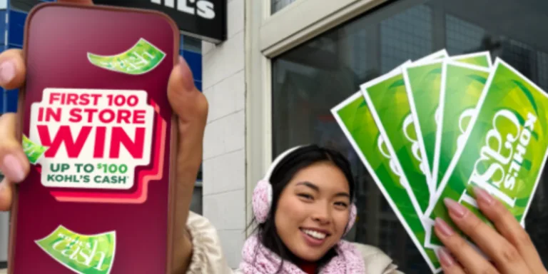 Woman holding Kohl's cash in front of store.