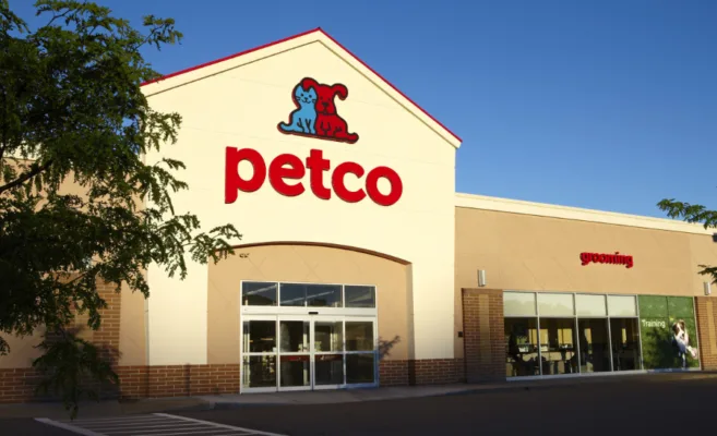 Petco store exterior with signage, trees visible.