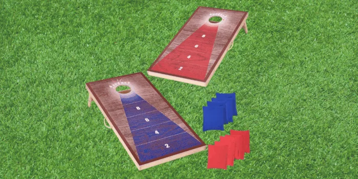 Cornhole game boards with red and blue bags.