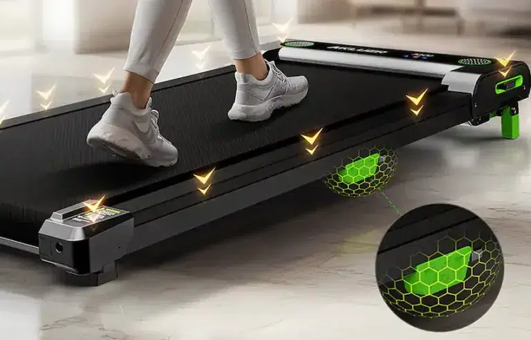 Person walking on a treadmill with green cushioning.