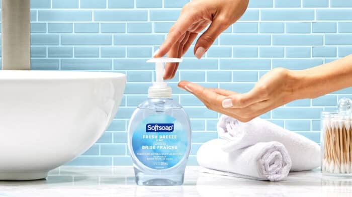 Dispensing Softsoap Fresh Breeze hand soap in bathroom.