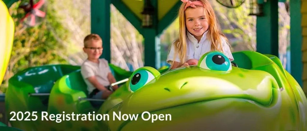 Kids on frog-themed amusement park ride