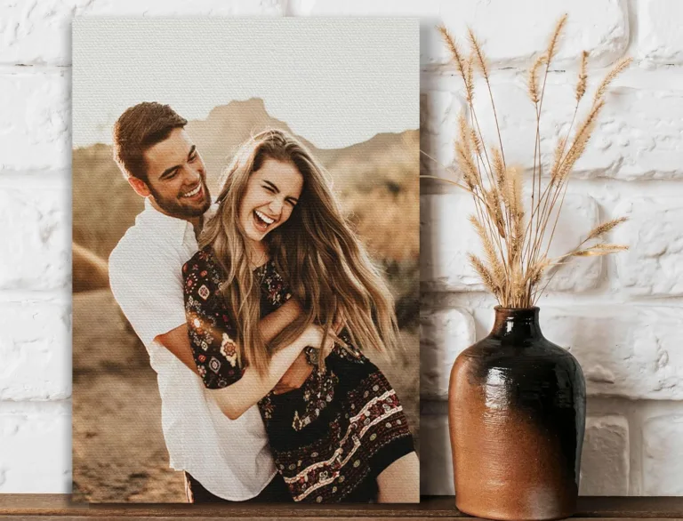 Smiling couple holding each other outdoors; earthy decor