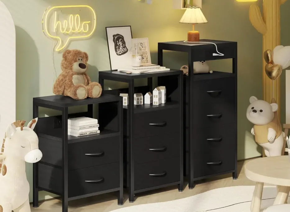 Playroom with black drawers and teddy bear decor.
