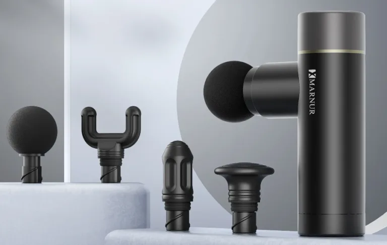 Massage gun with various attachments displayed.