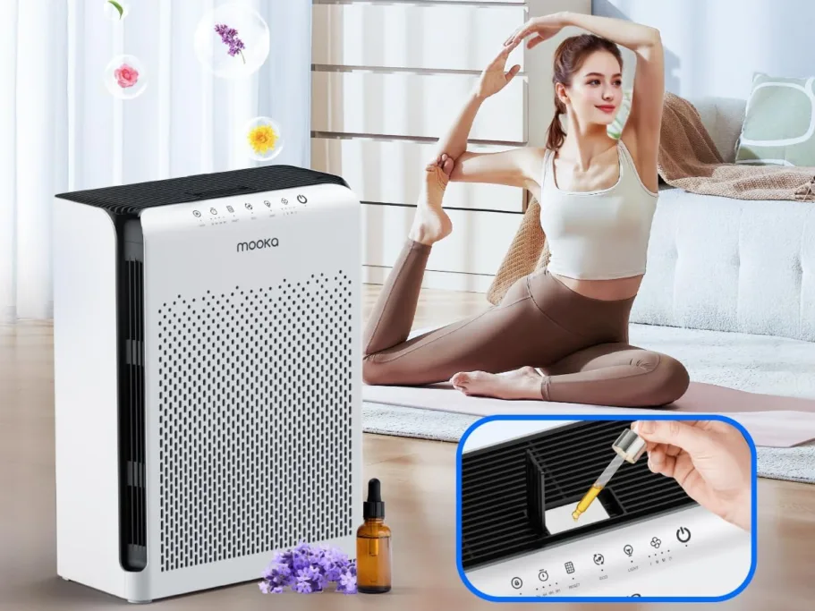 Yoga woman next to air purifier with essential oils.