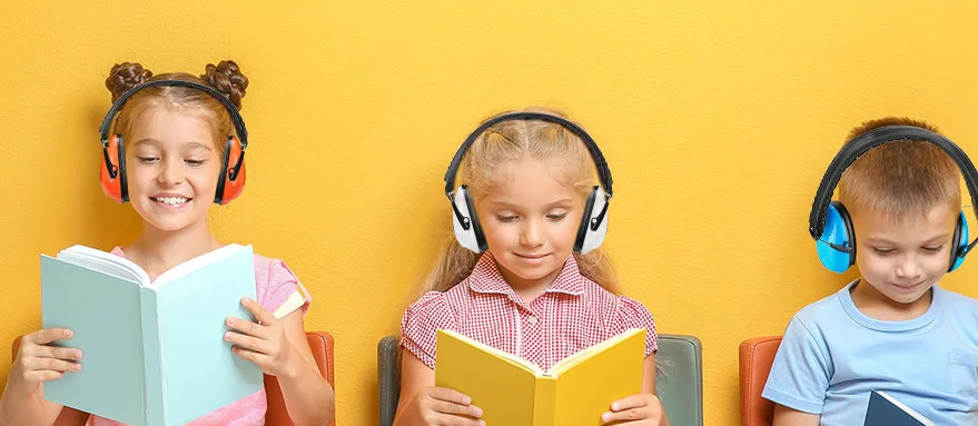 Children reading books and listening to headphones.