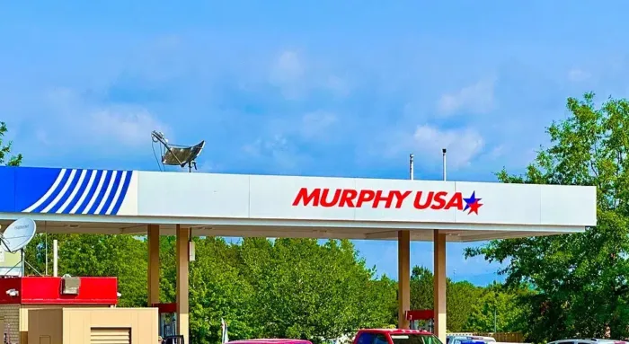 Murphy USA gas station with red truck parked.