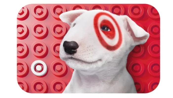 White dog with red target design background.