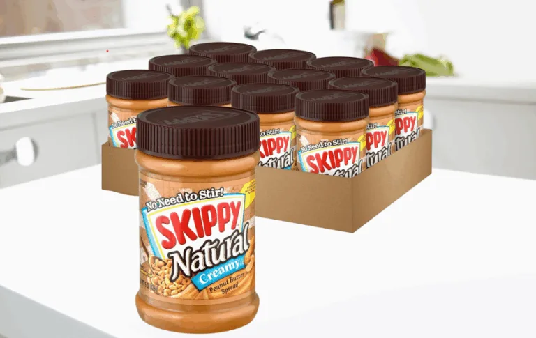 Natural creamy peanut butter jars on kitchen counter.