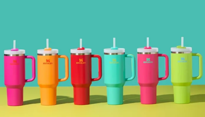 Colorful travel mugs with handles and straws