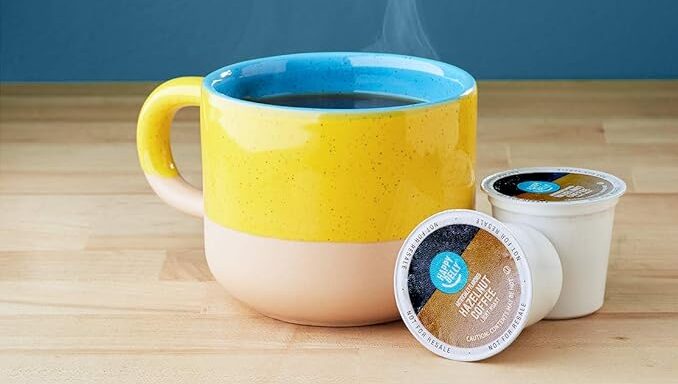 Colorful mug with coffee and coffee pods