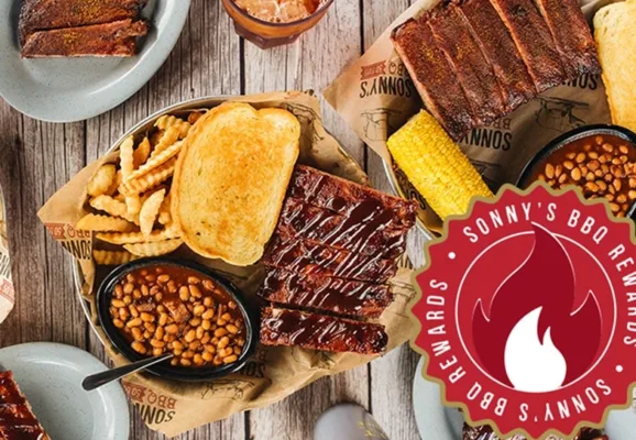 BBQ ribs, fries, beans, corn, and toast platter.
