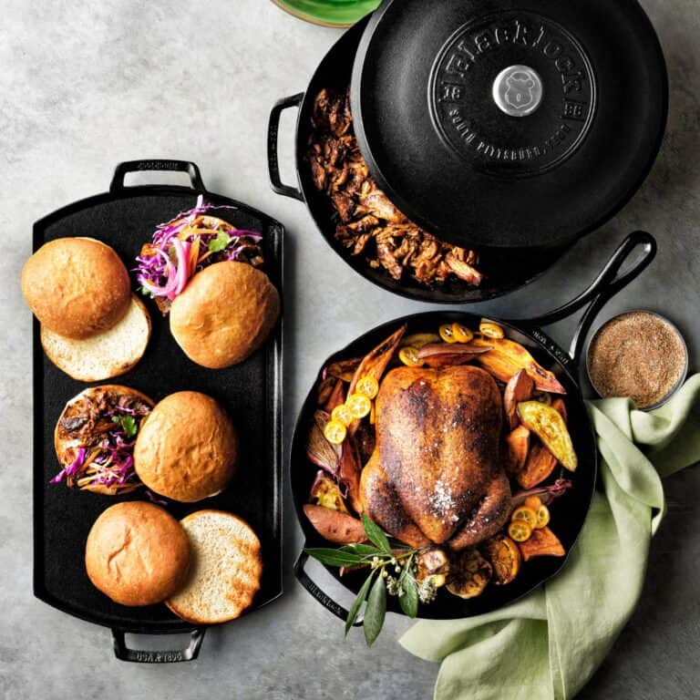 Cast iron dishes with roasted chicken and burgers.