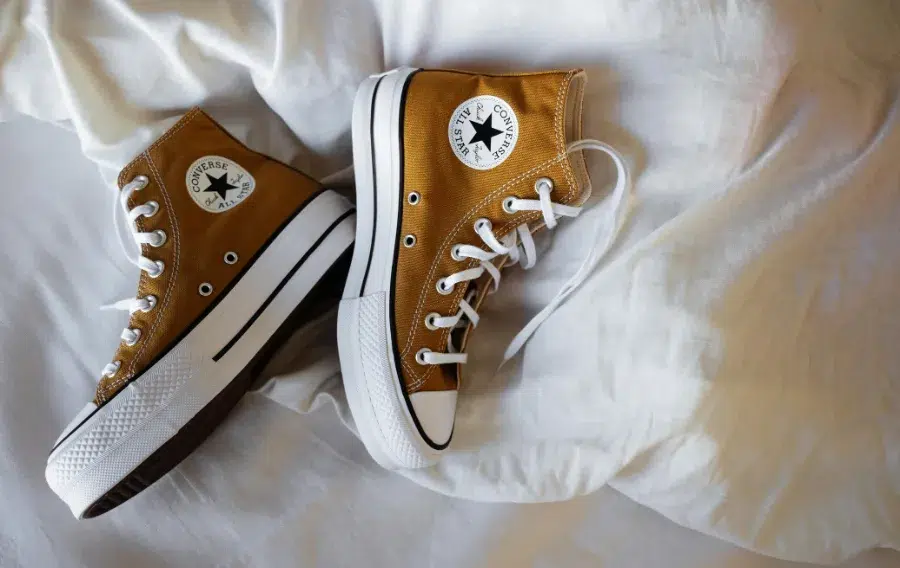 Brown Converse sneakers on white sheet