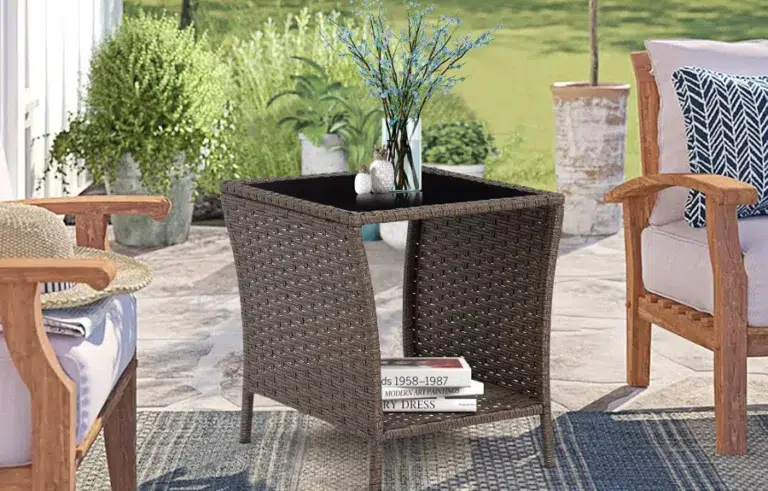Wicker patio table with vase and books.