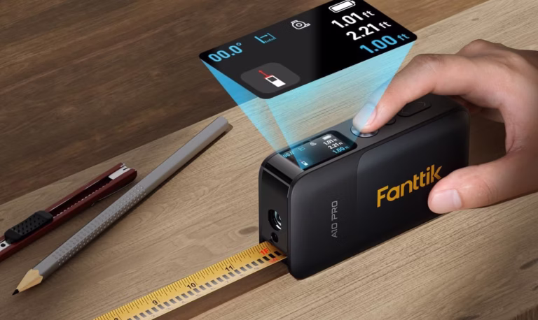 Digital tape measure with HD display on wood surface.