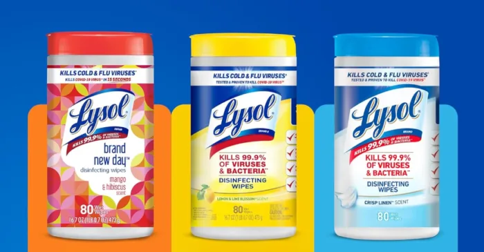 Three Lysol disinfecting wipe containers in different scents.