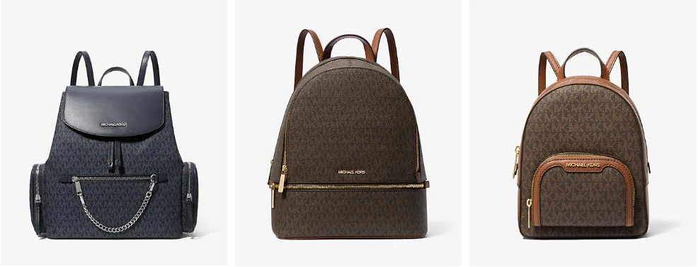 Three stylish designer backpacks on display.